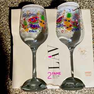 New never been used in box 2 decorated wine glasses.